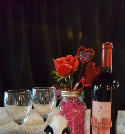 glasses, bottle, arrangement with hearts and stuffed animal